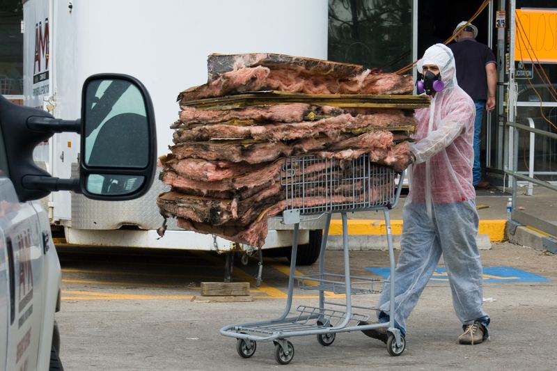 Worker in a protective hazmat suit during a response exercise